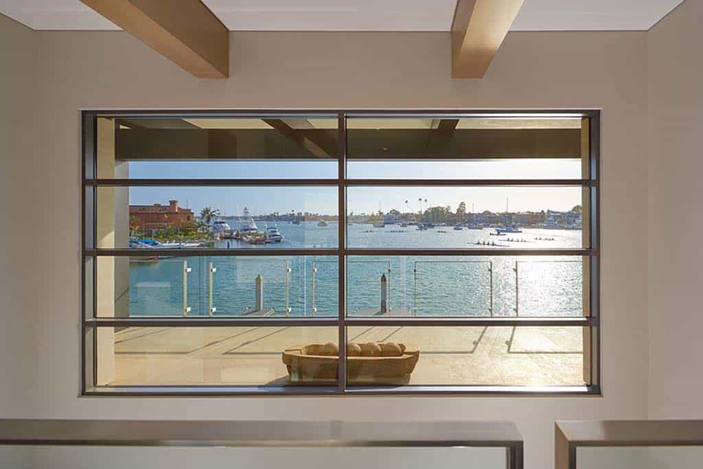 contemporary upstairs hallway with a large window and water view