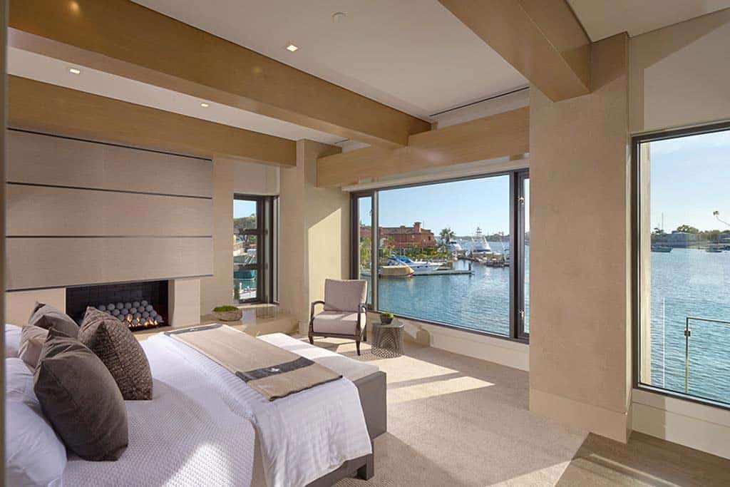 contemporary bedroom with a water view