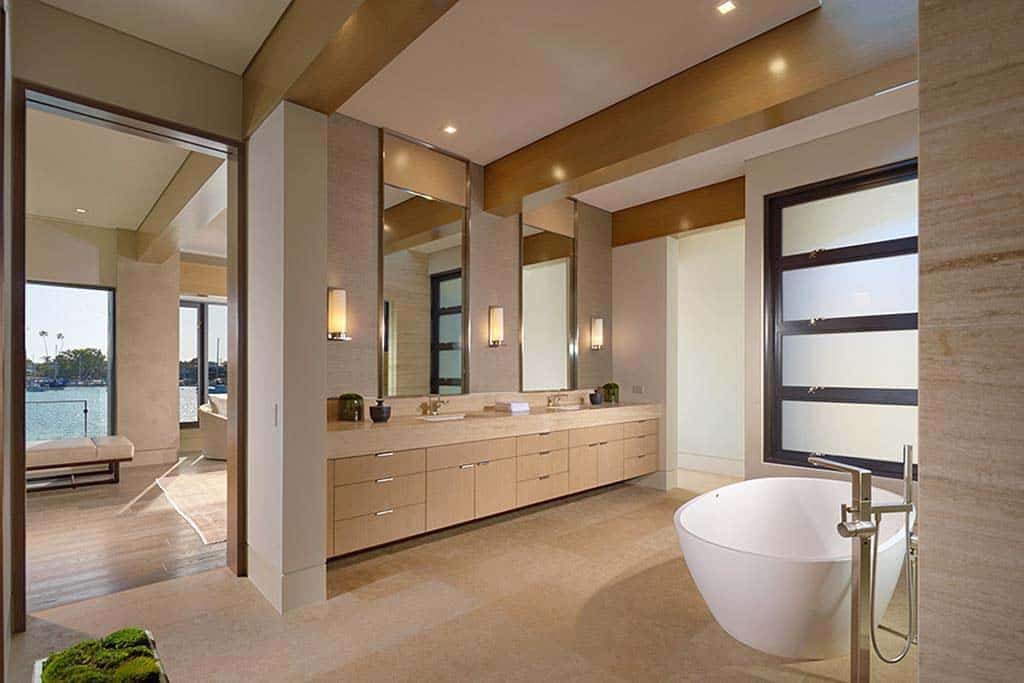 contemporary bathroom with a vanity and freestanding tub