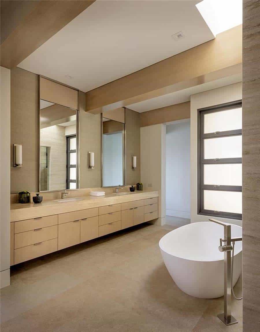 contemporary bathroom with a vanity and freestanding tub