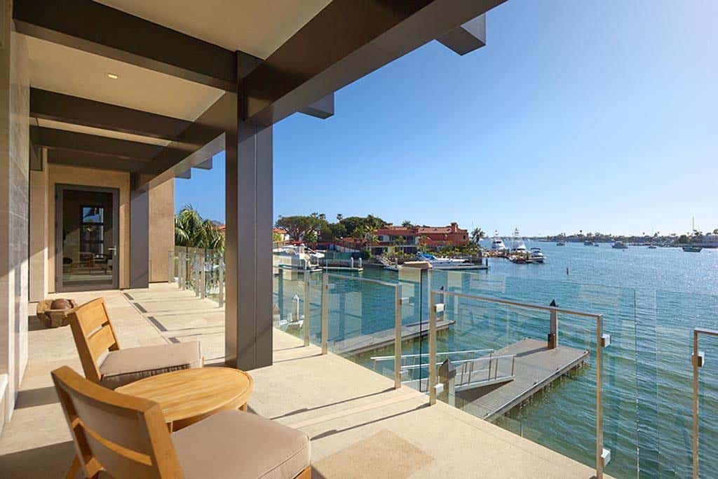 contemporary home deck with a water view
