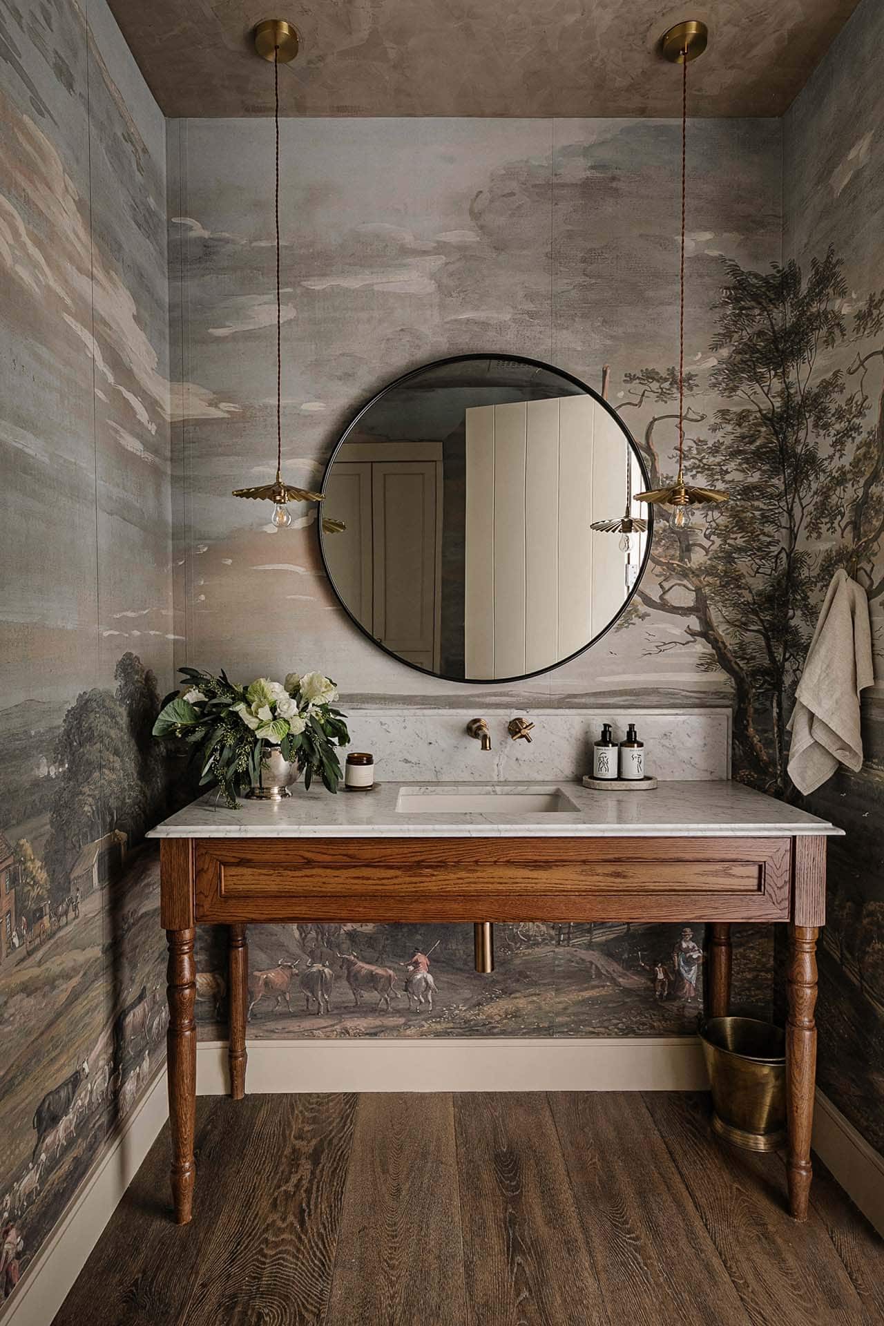 modern bathroom vanity with a round mirror