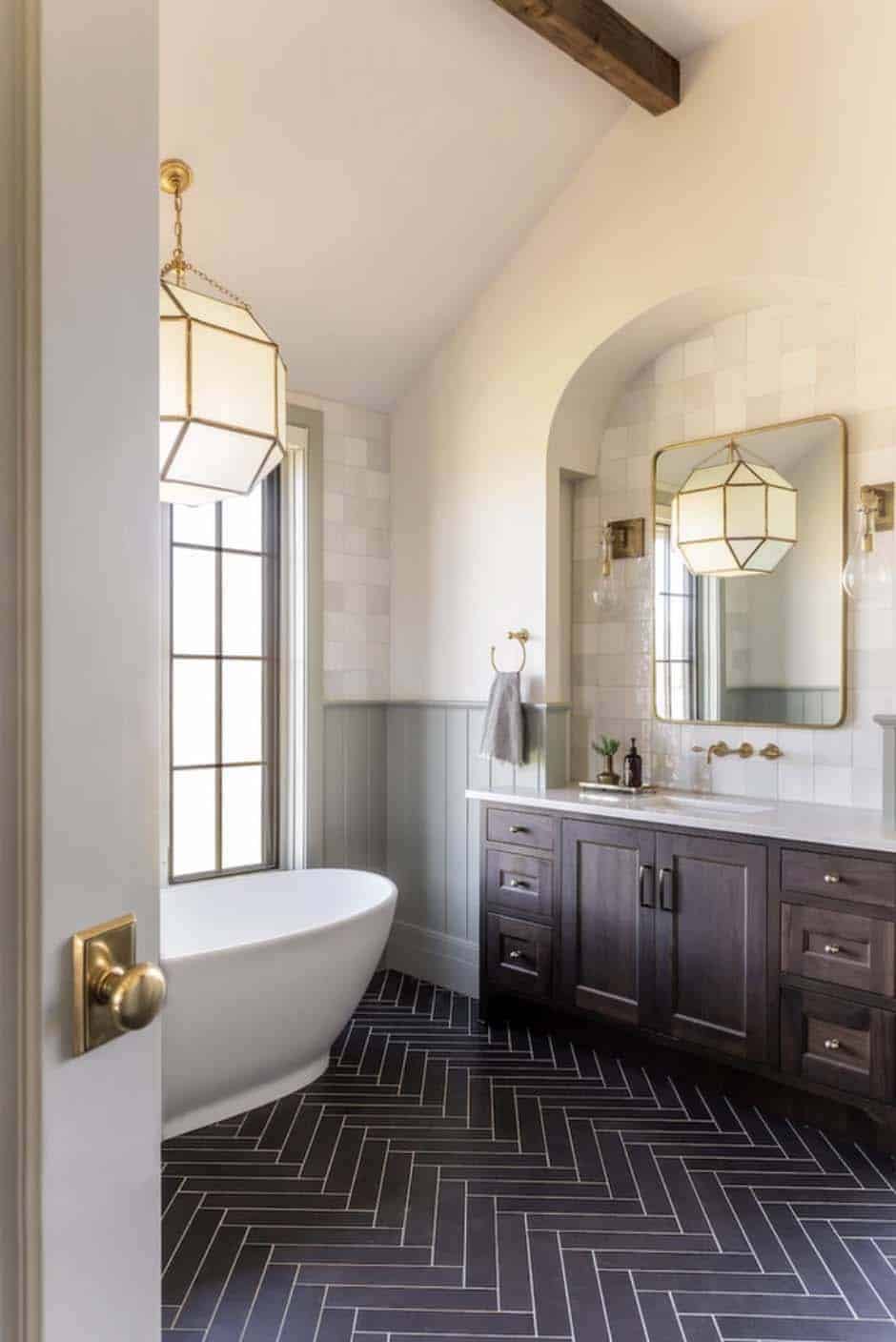 English country style bathroom with a vanity and freestanding tub