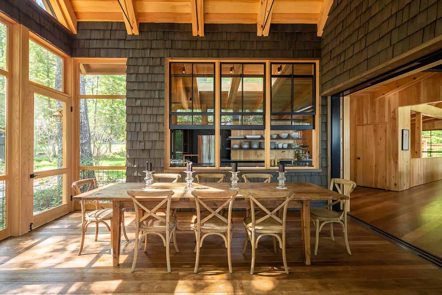 rustic outdoor covered patio with a pass-through window from the kitchen and counter stools
