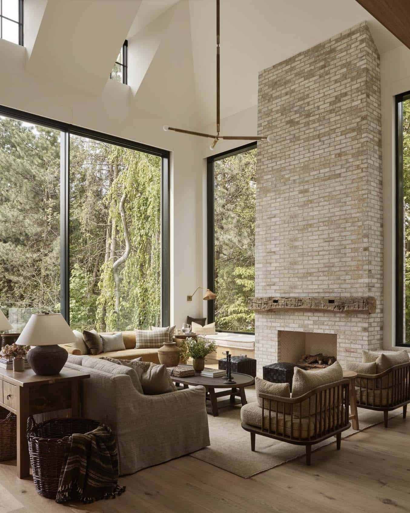 gorgeous transitional style living room with large windows and floor-to-ceiling fireplace