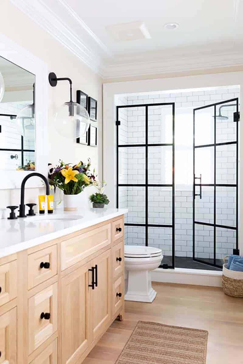 greek revival style bathroom with a vanity and shower