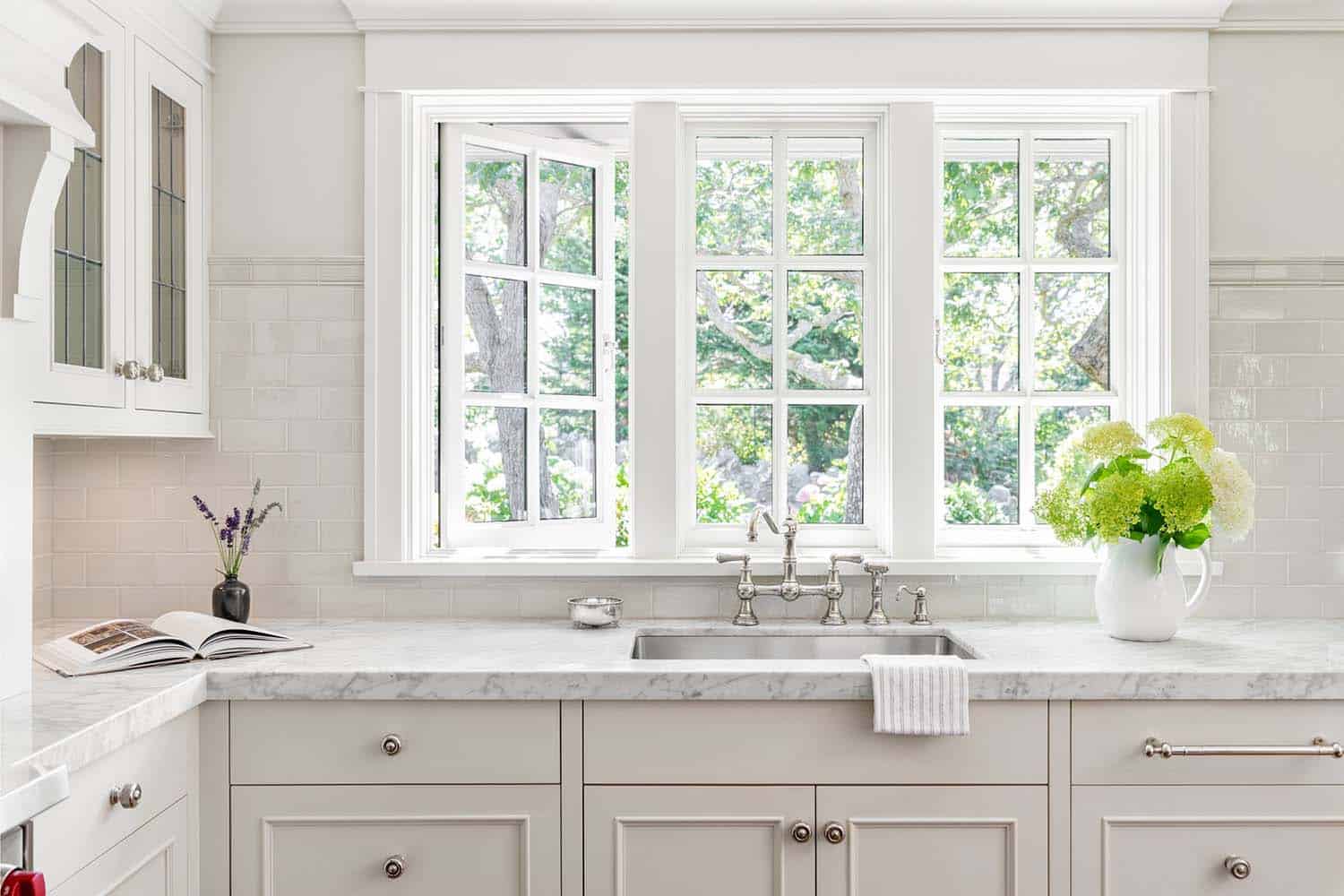 traditional kitchen with a view of the sink with a window above
