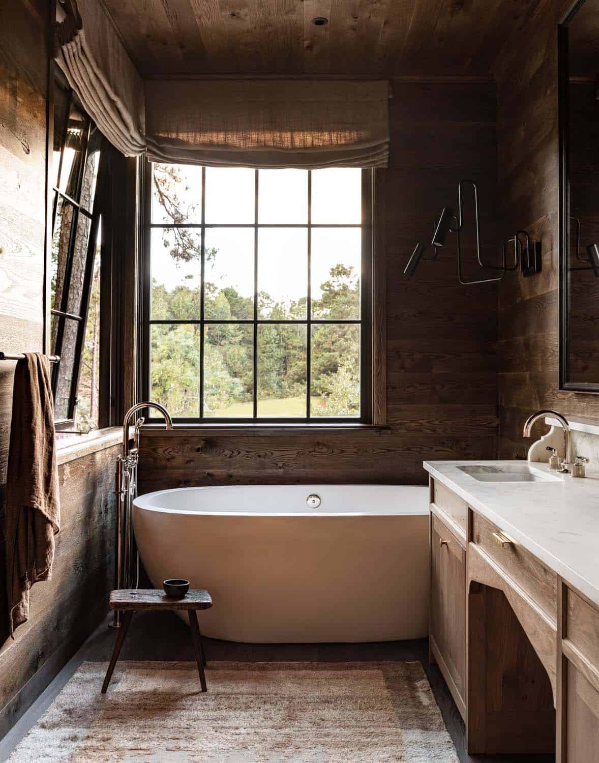 rustic bathroom with a vanity and freestanding tub