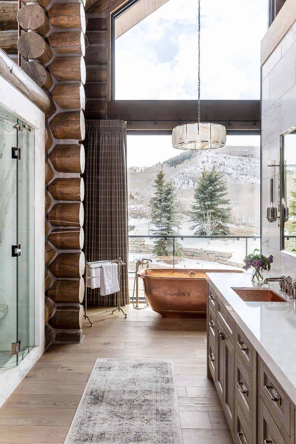 log cabin mountain home bathroom with a copper tub