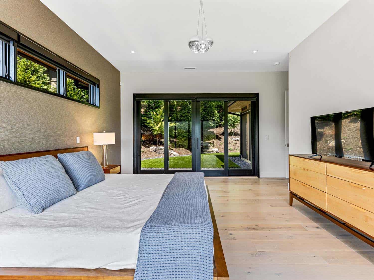 modern bedroom with sliding glass doors