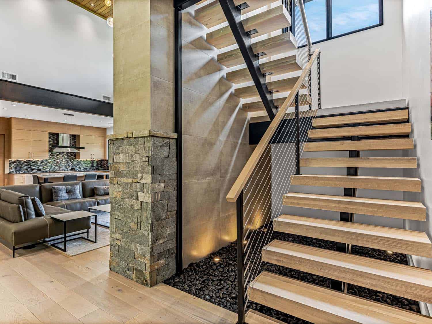 modern staircase with open risers and wood treads