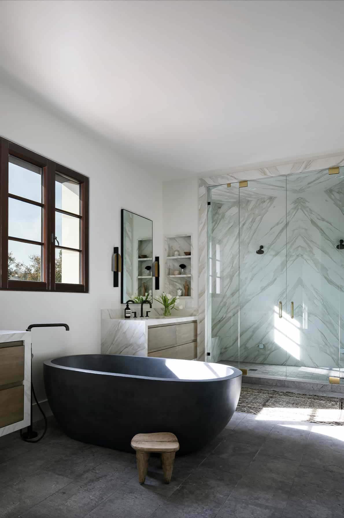 mediterranean style bathroom with a freestanding tub and shower