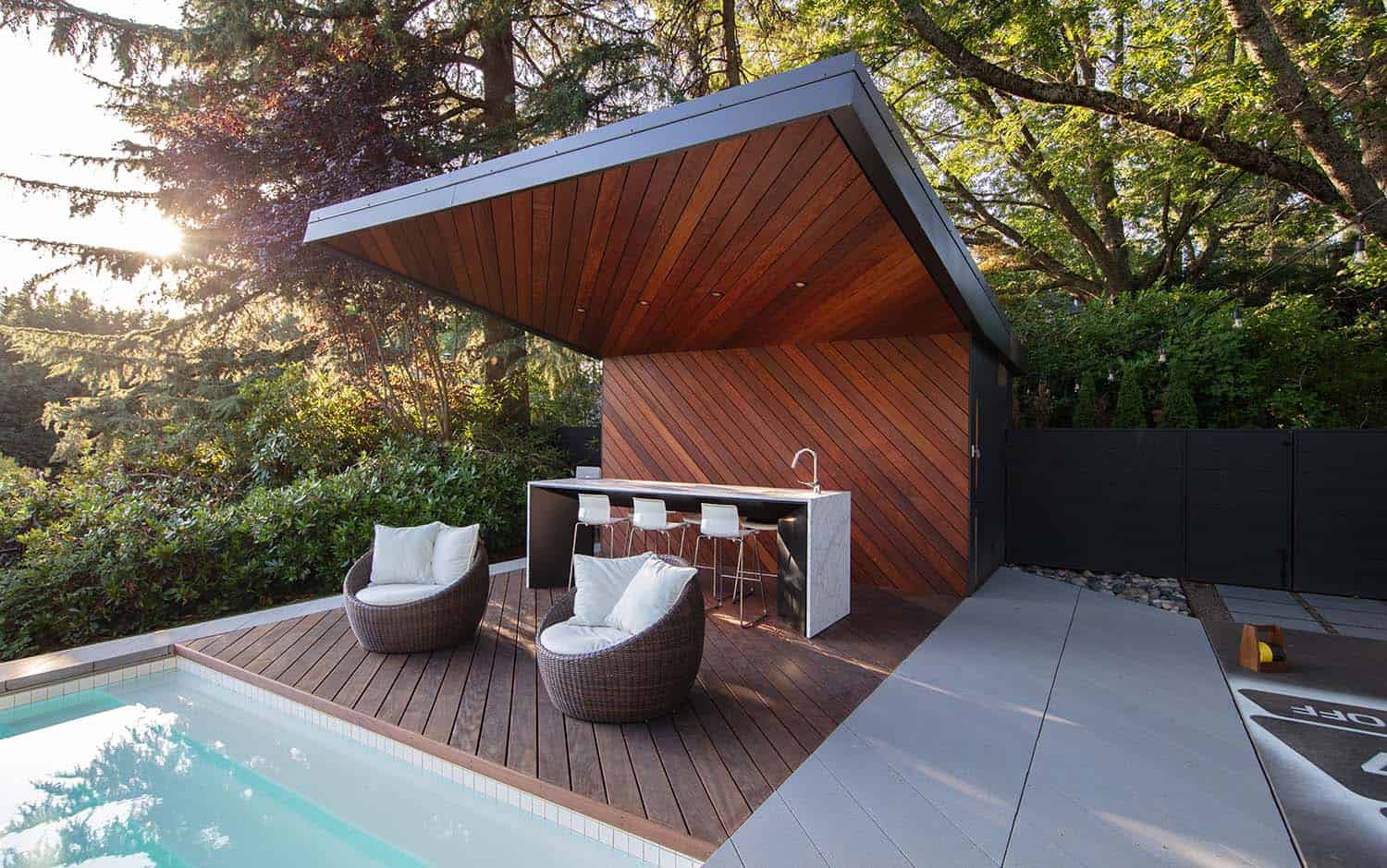 midcentury modern house swimming pool with a covered outdoor kitchen