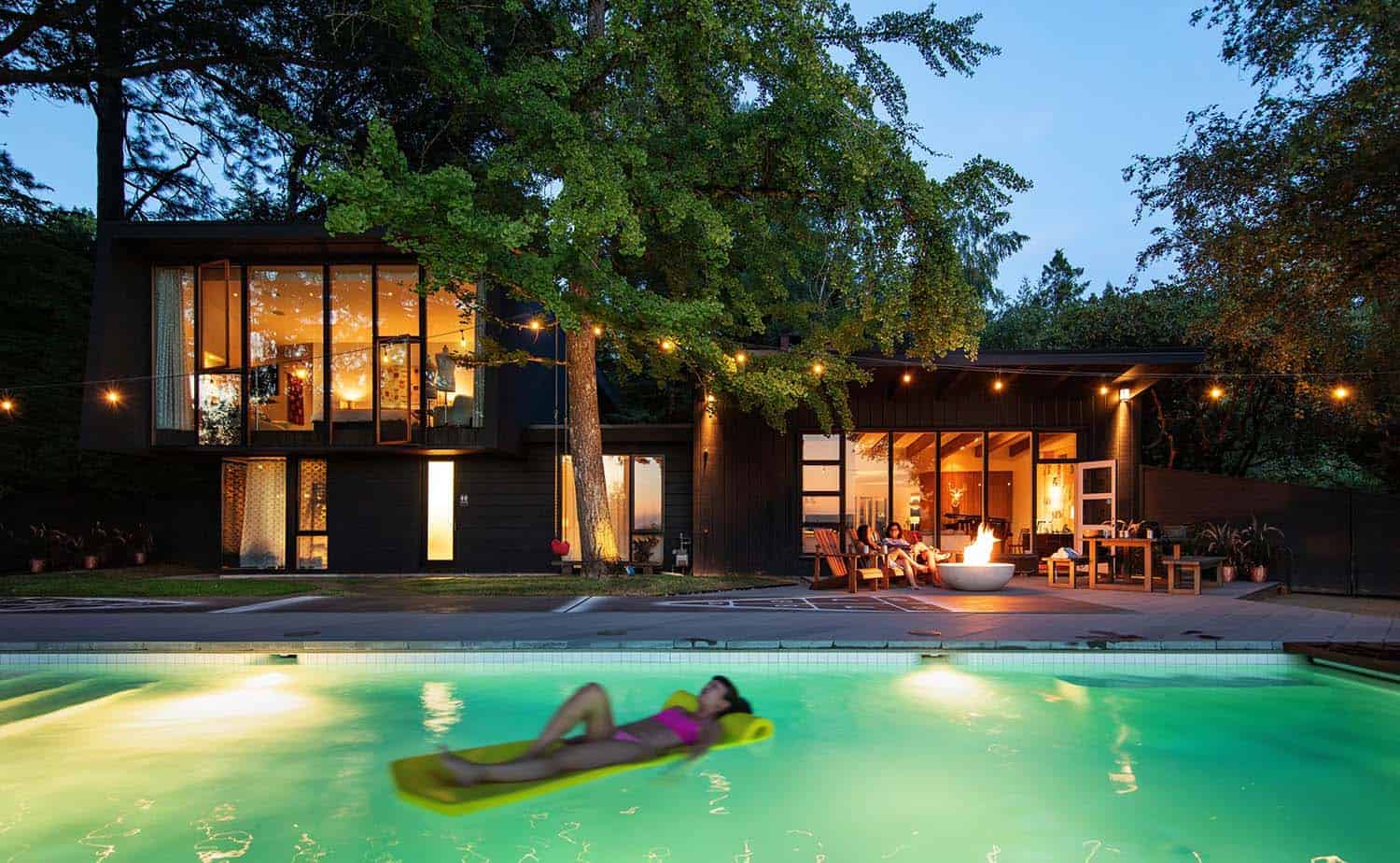 midcentury modern house swimming pool at dusk
