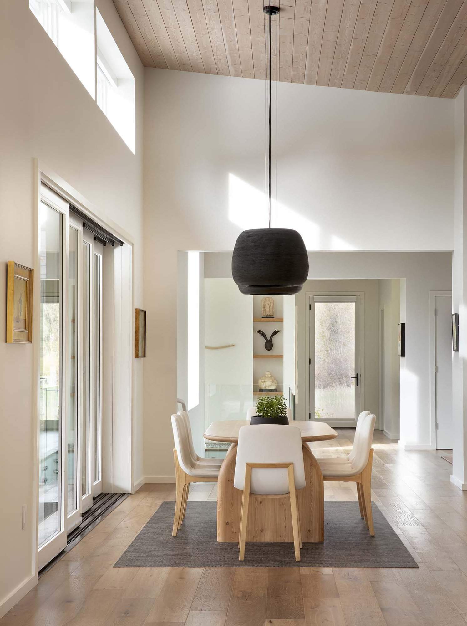 minimalist dining room with large windows