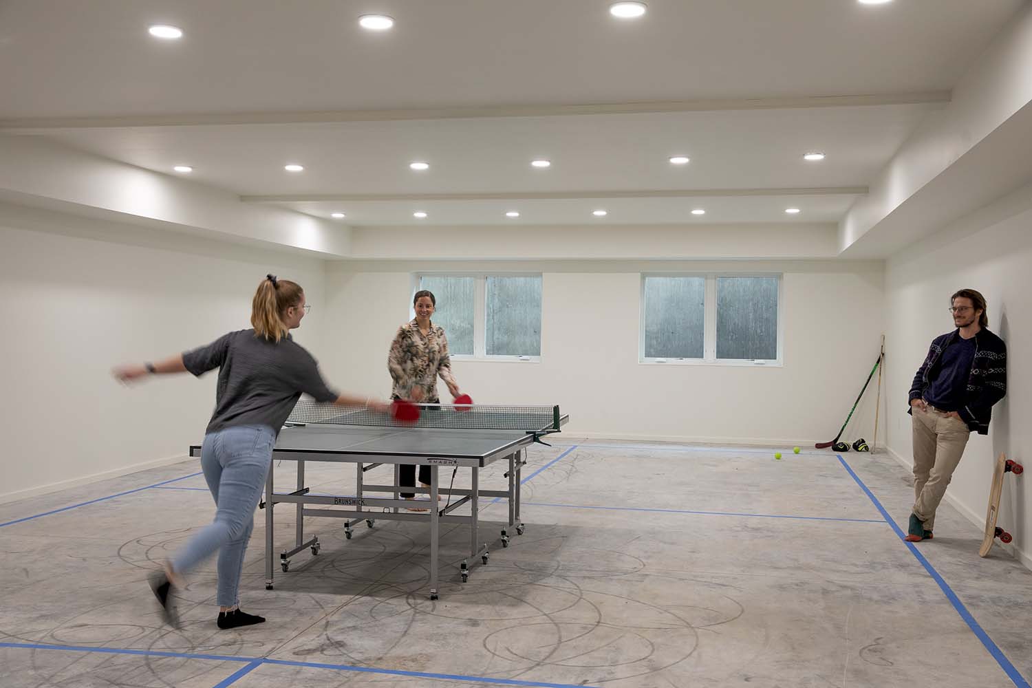 modern entertainment room with a ping pong table