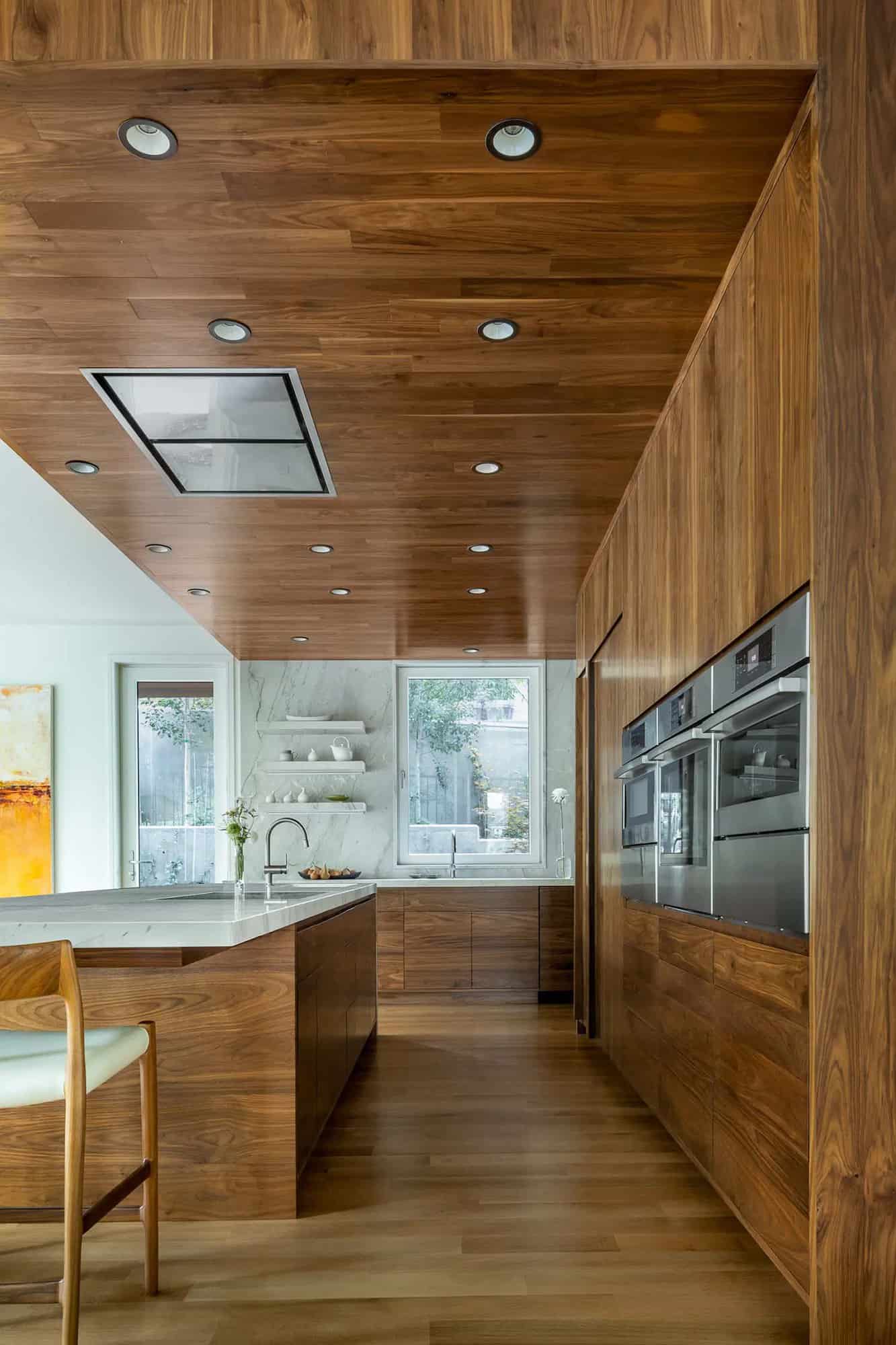 modern kitchen with a wood wall