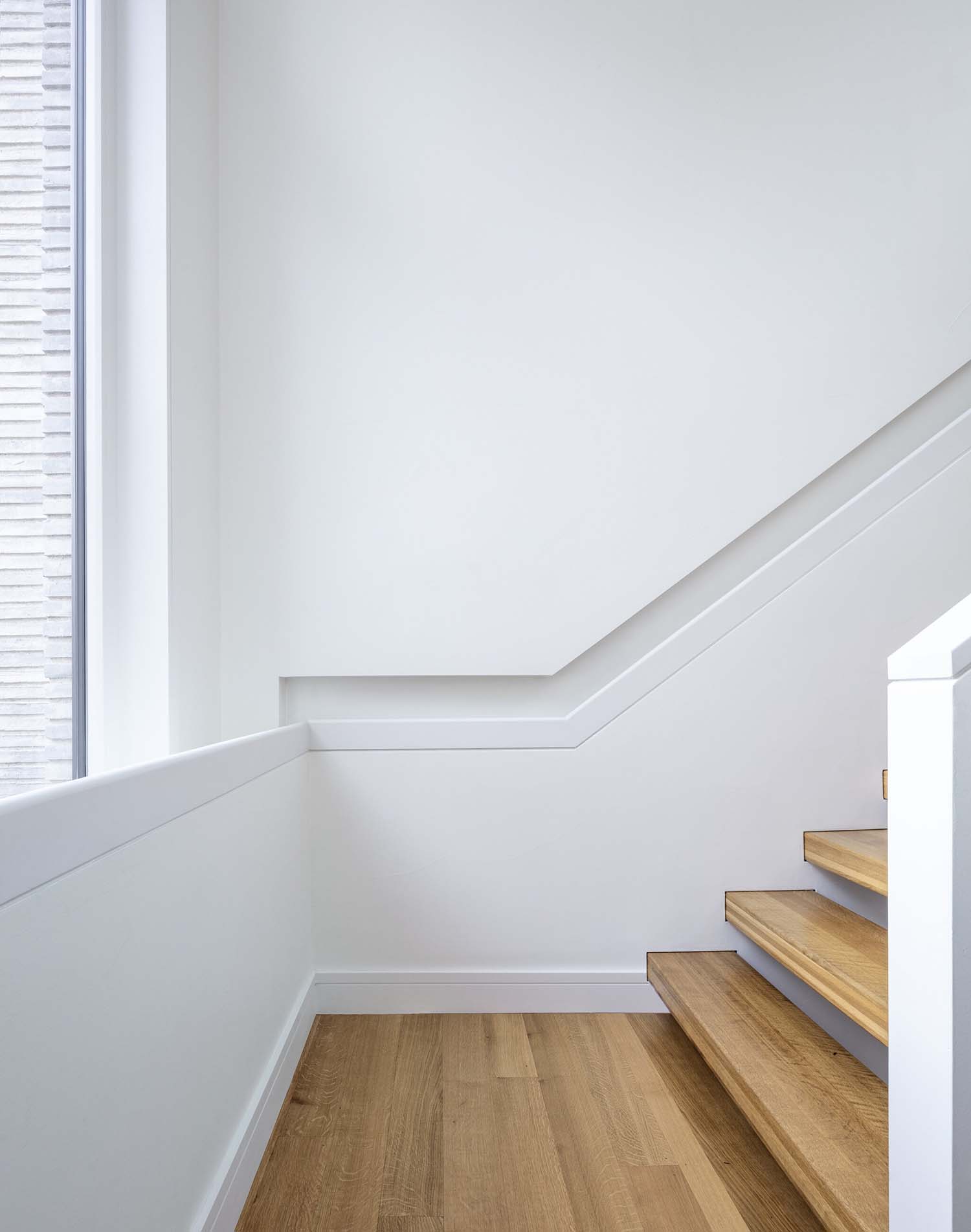 modern staircase with white walls