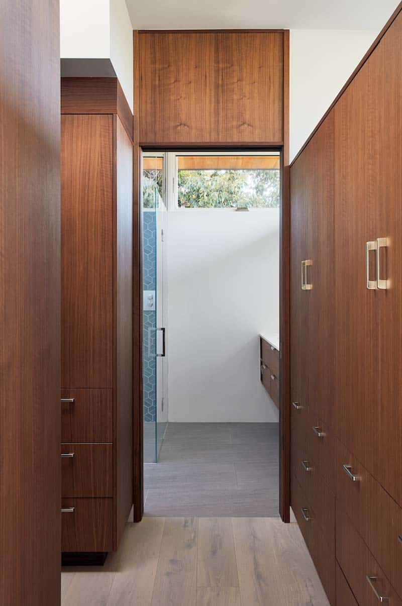 modern closet leading into the bathroom