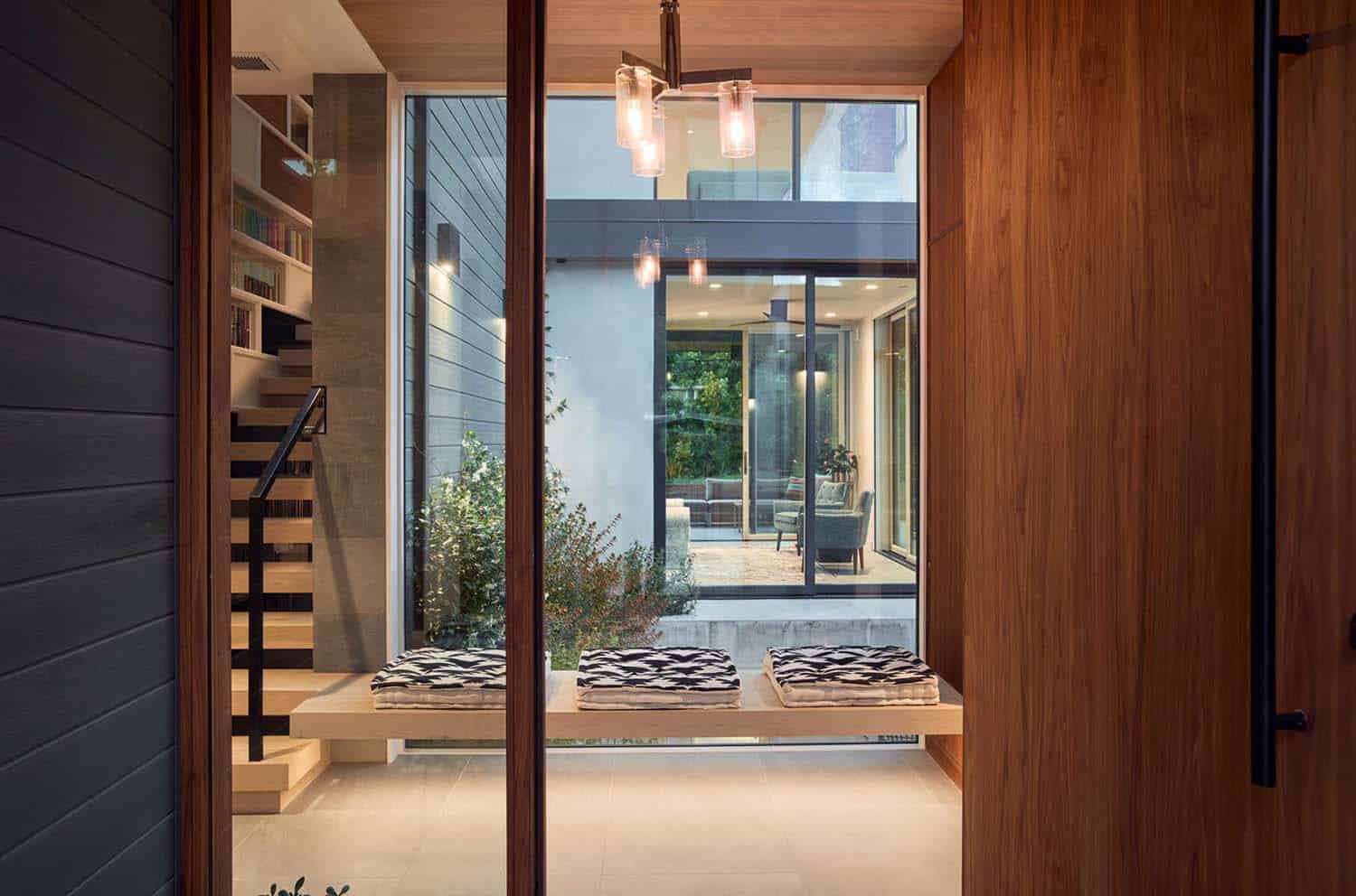 modern built-in bench with a window looking into the center courtyard