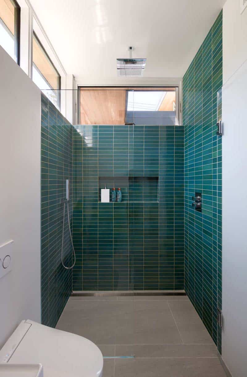 modern bathroom with a walk-in shower and blue tiles