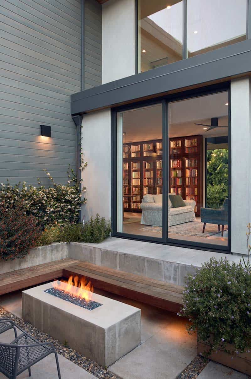 modern home exterior with a patio and outdoor fire pit