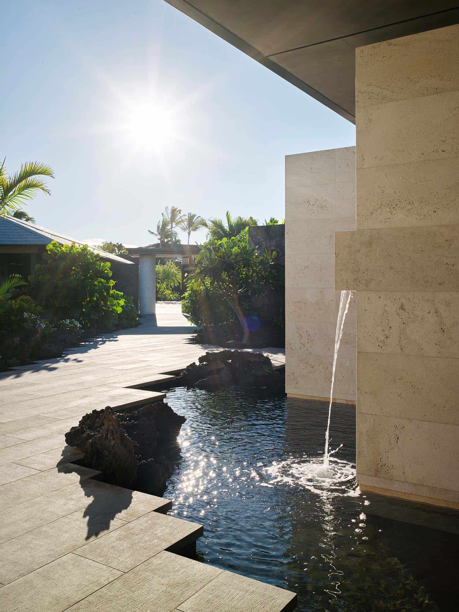 modern coastal style outdoor patio with a water feature