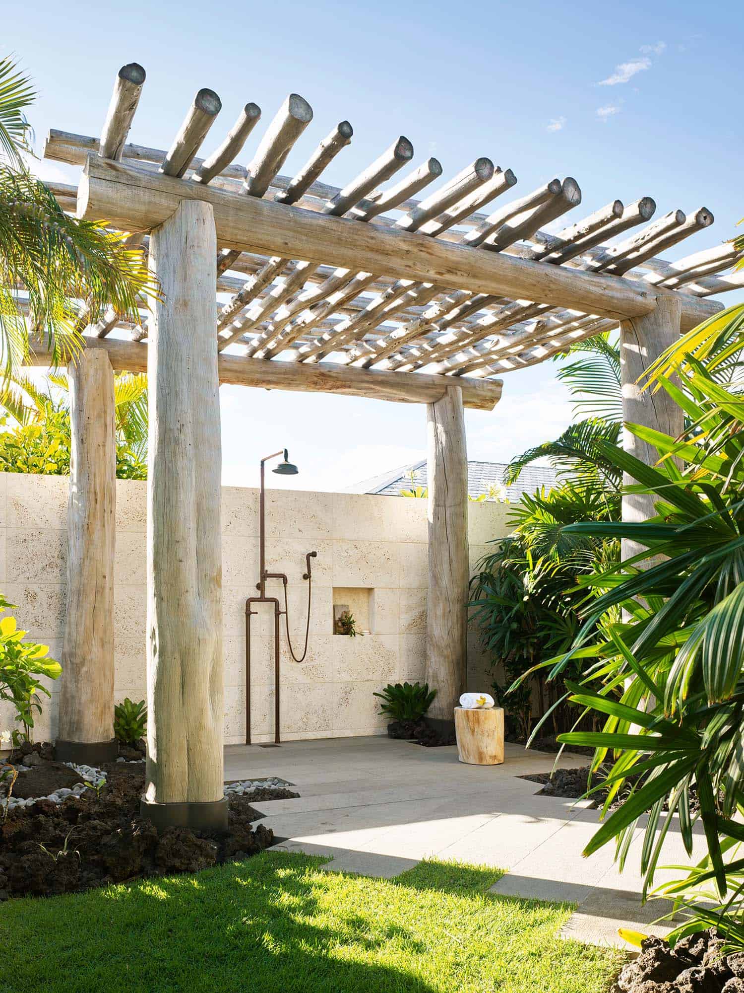modern coastal style outdoor shower with a trellis