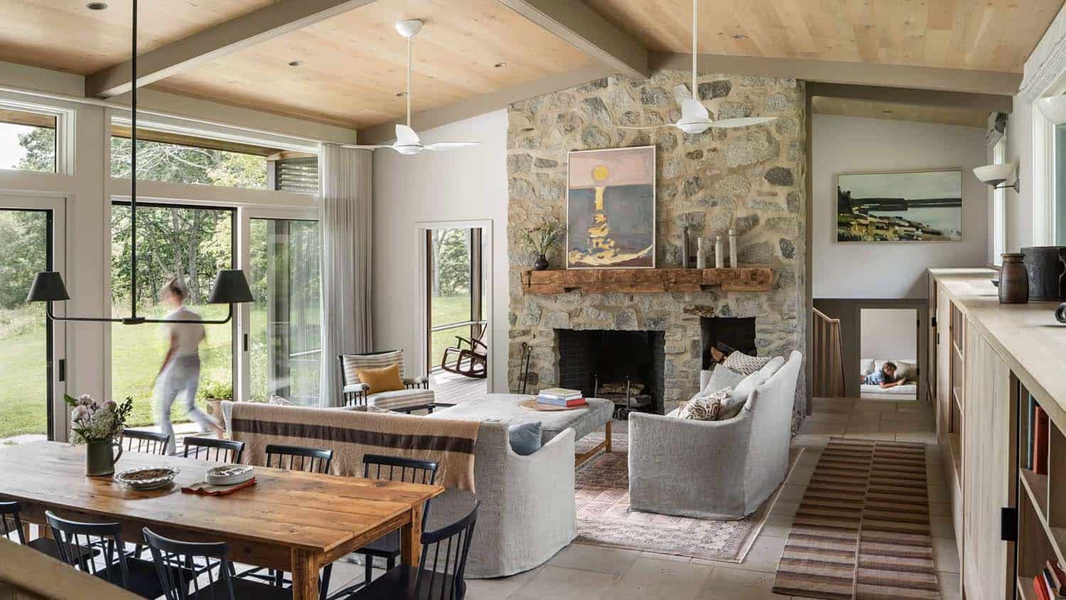 modern coastal style dining and living room with a fireplace
