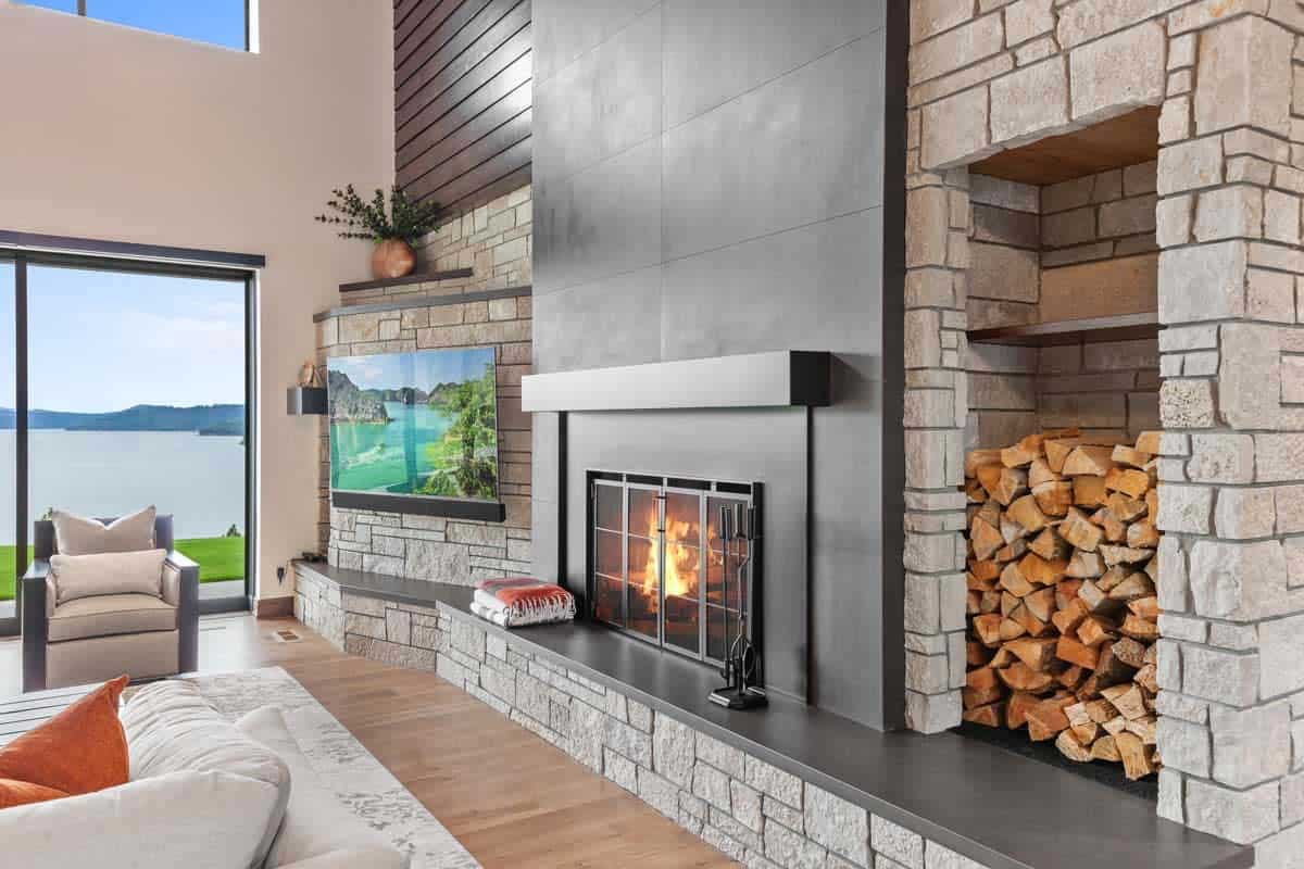 modern living room with a fireplace and log storage