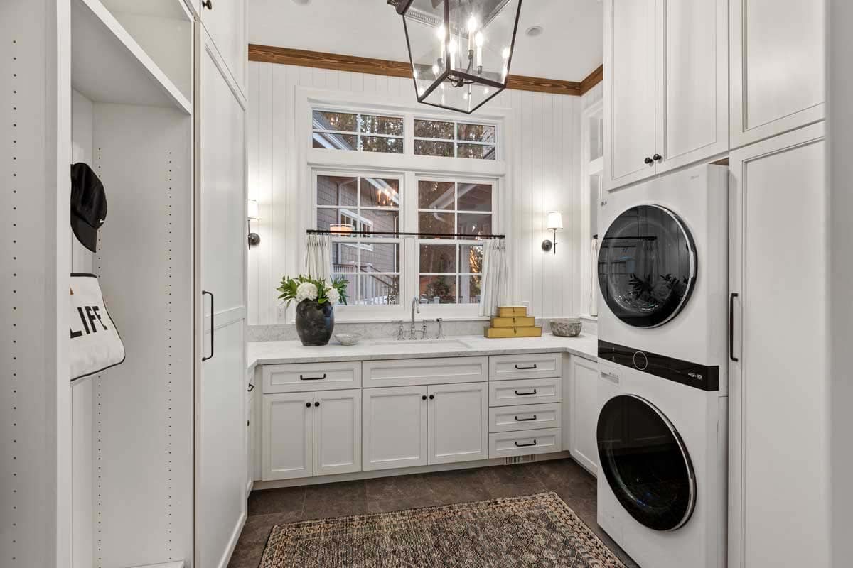 modern laundry room with a stackable washer and dryer