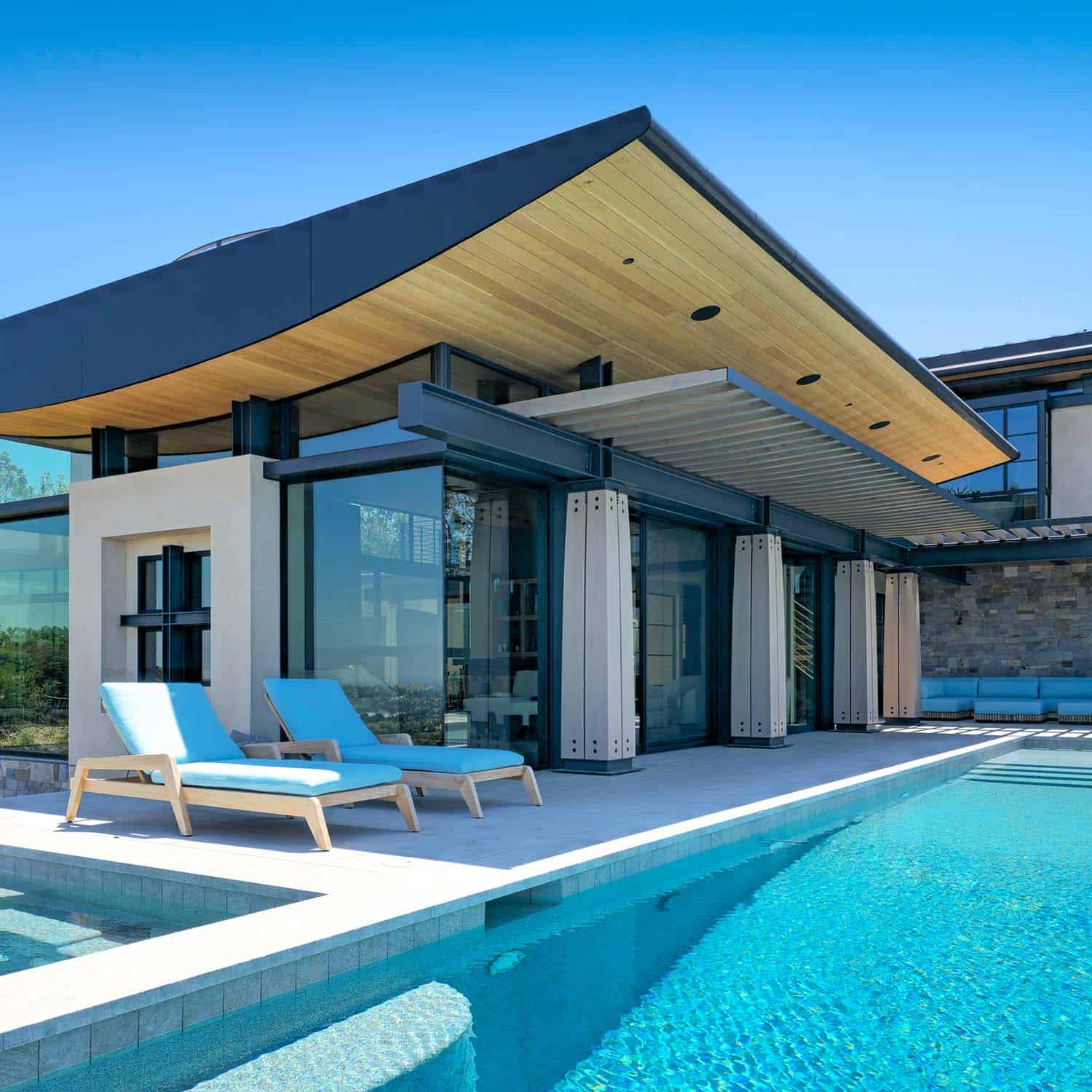 modern hilltop house patio with a pool