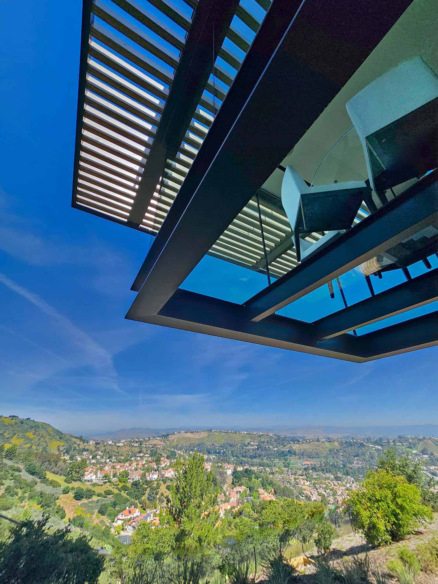 modern hilltop house exterior view of the dining room cantilever