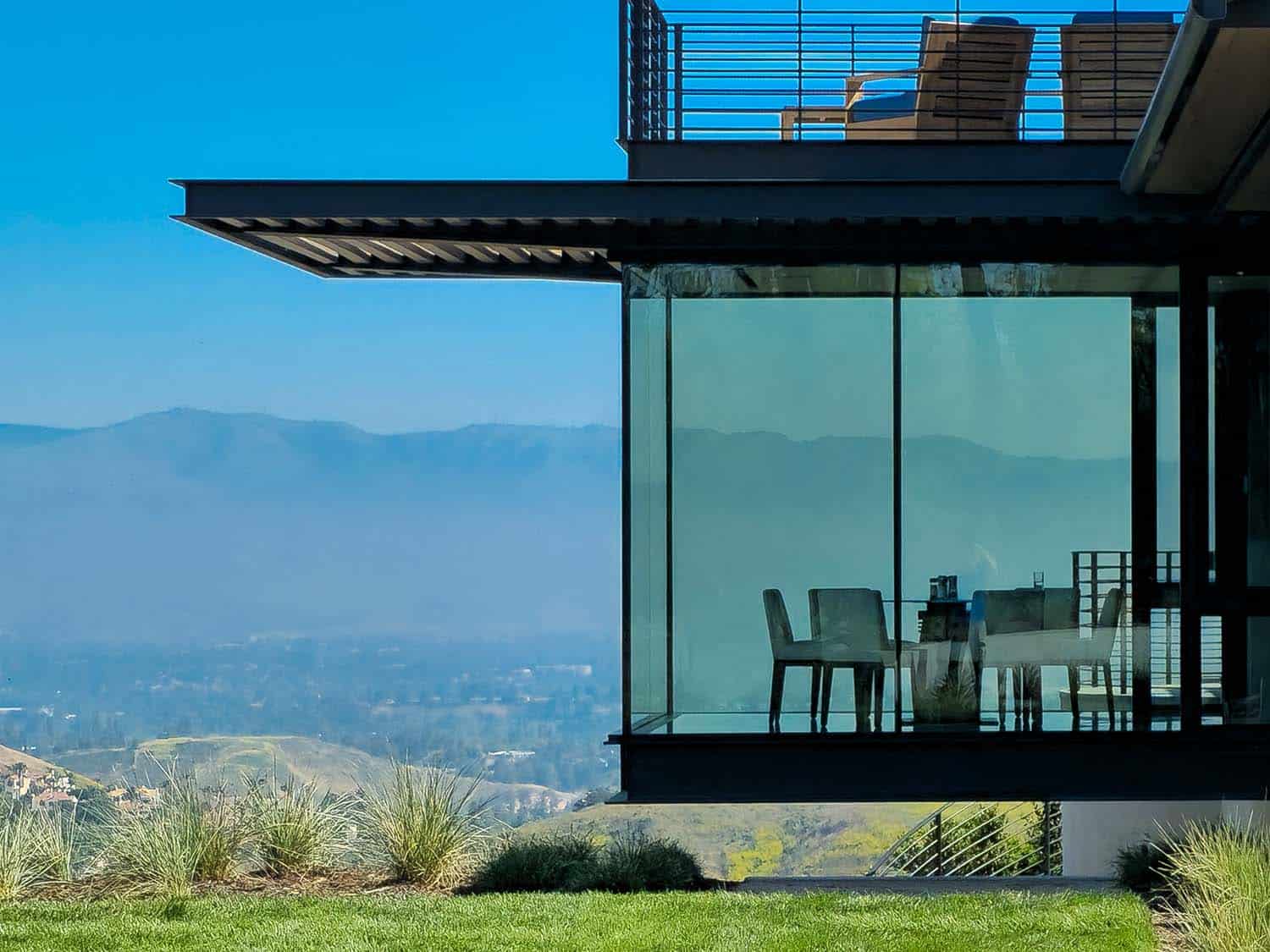 modern hilltop house exterior view of the dining room cantilever