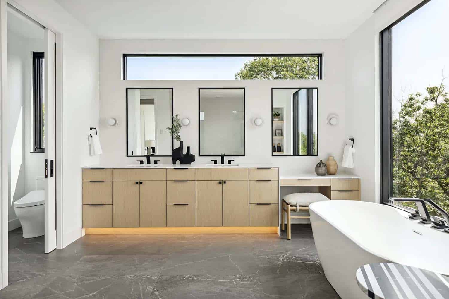 modern bathroom with a vanity and freestanding tub
