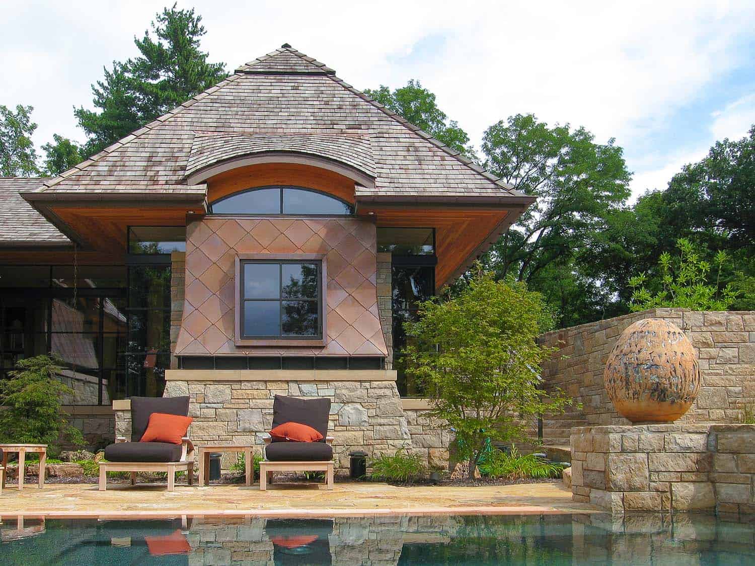 modern cottage exterior patio with a pool