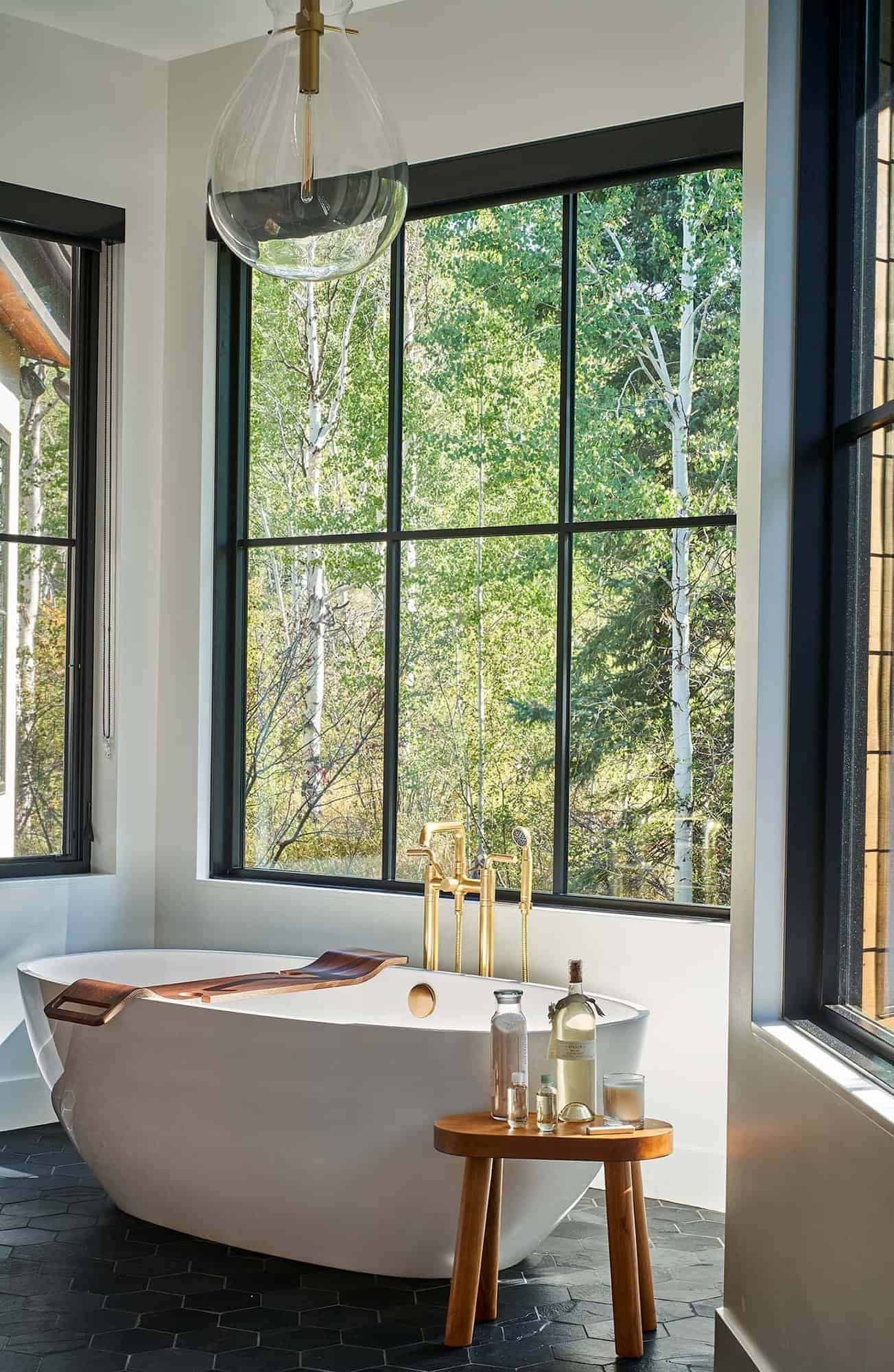 modern bathroom with a freestanding tub with a large window