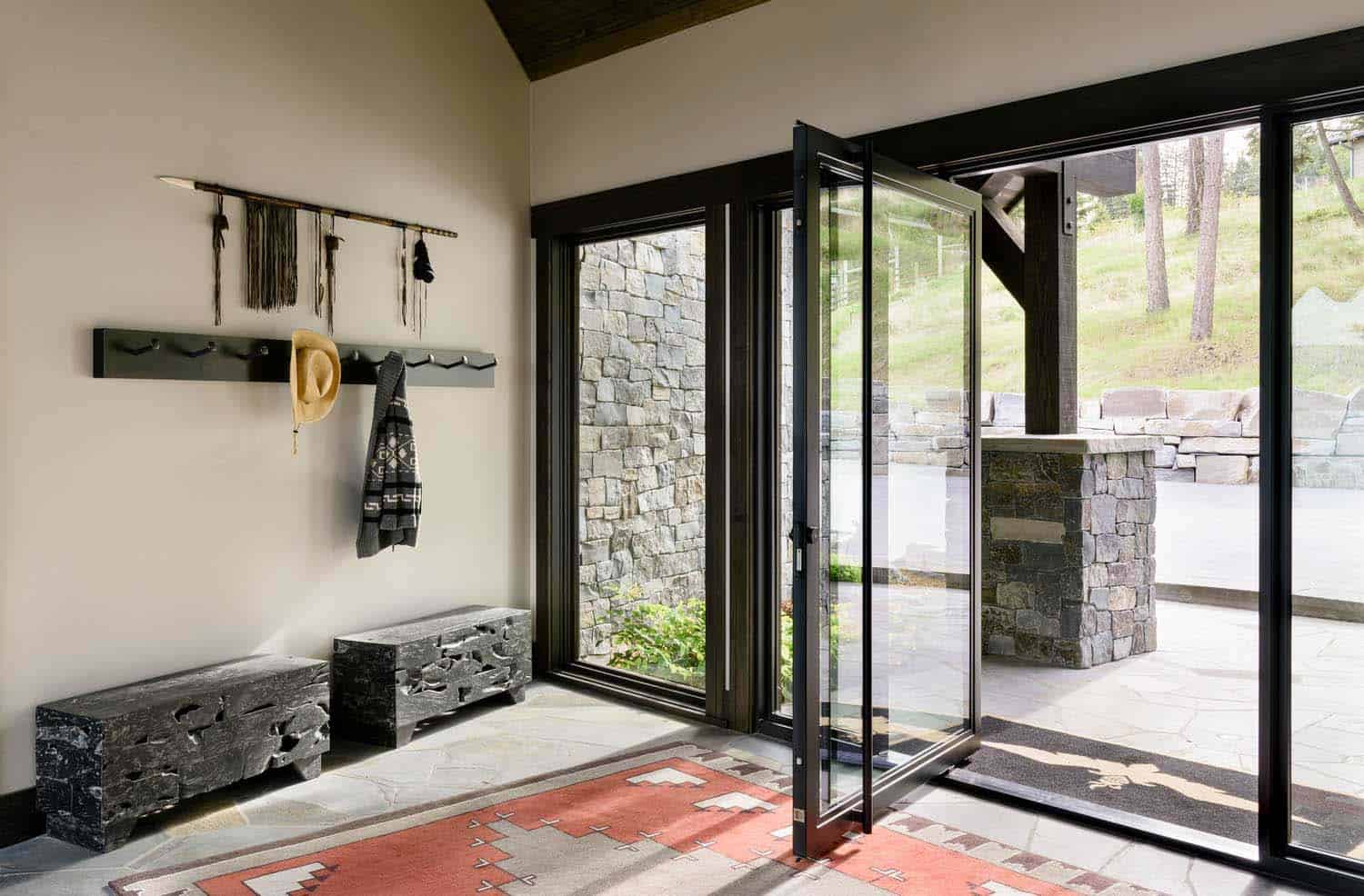 modern-rustic lake house entry with a pivoting door