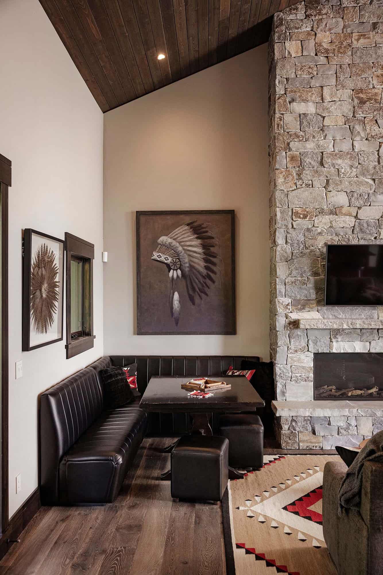modern-rustic family room with a stone fireplace