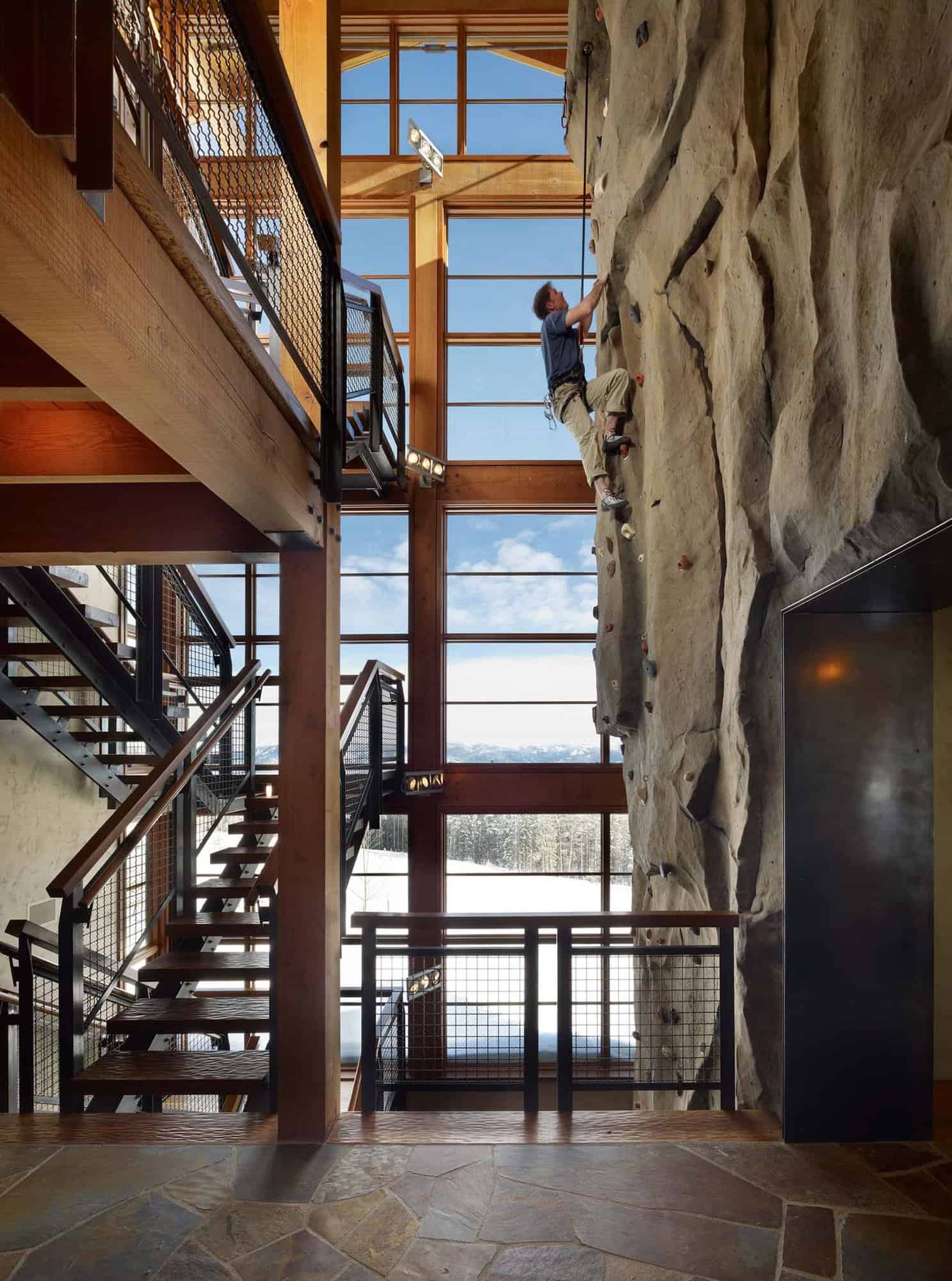 modern rustic staircase and rock climbing wall