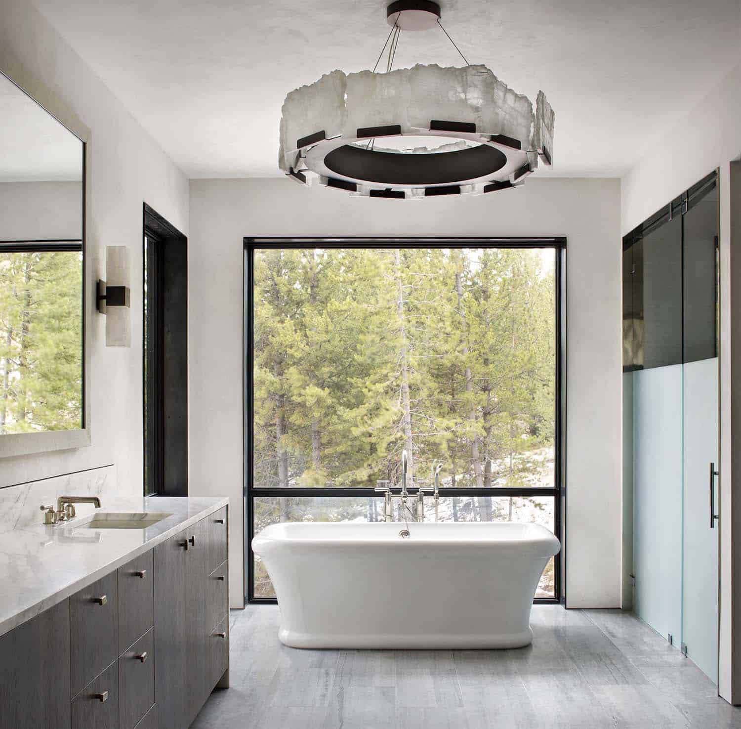 mountain modern bathroom with a vanity and freestanding tub 