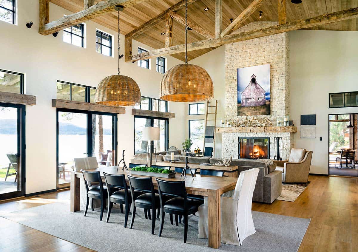 rustic modern dining room looking towards the living room with a fireplace