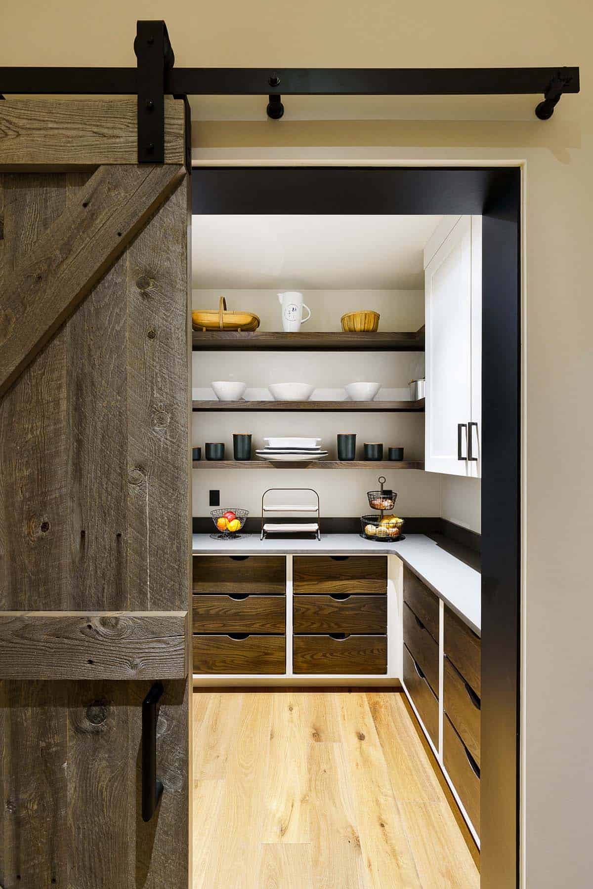 rustic modern kitchen pantry with a sliding barn door