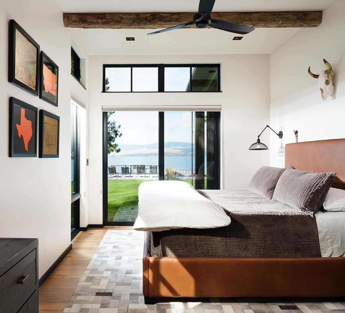 rustic modern bedroom with a sliding door access to the backyard and lake