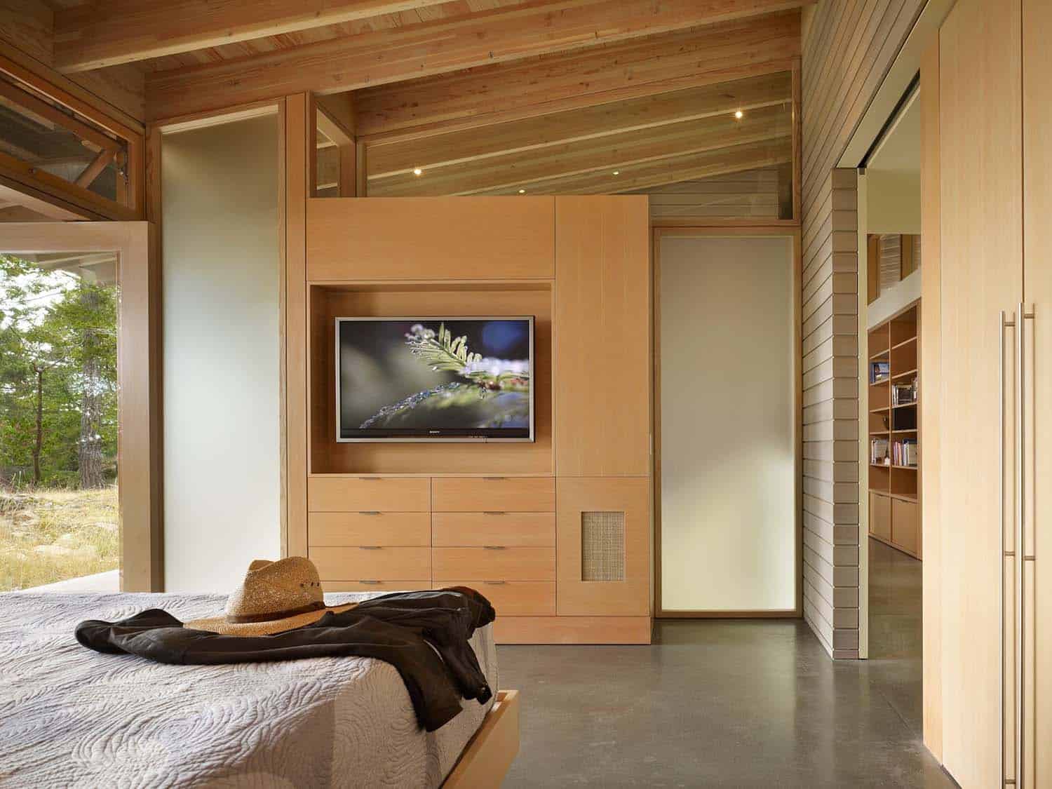 modern bedroom with a built-in furniture and tv