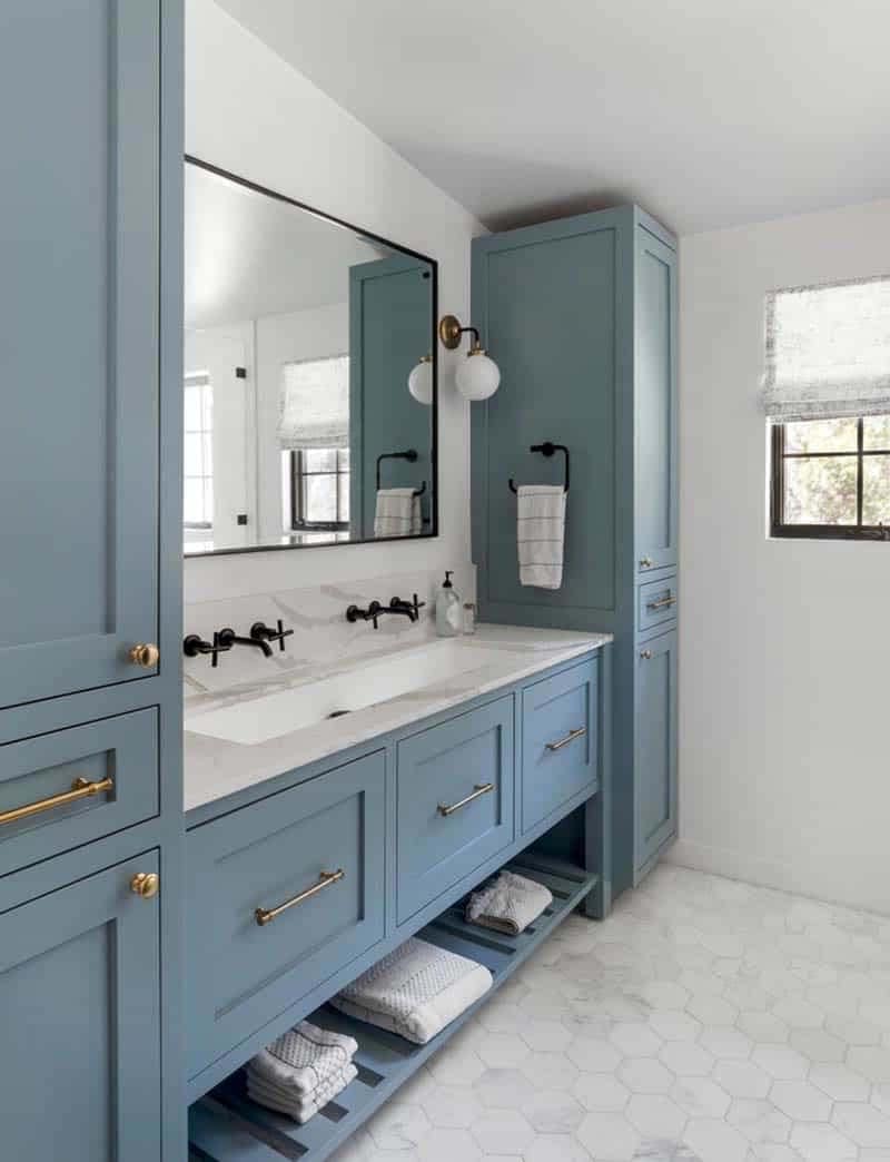 ranch house revival bathroom with blue cabinets
