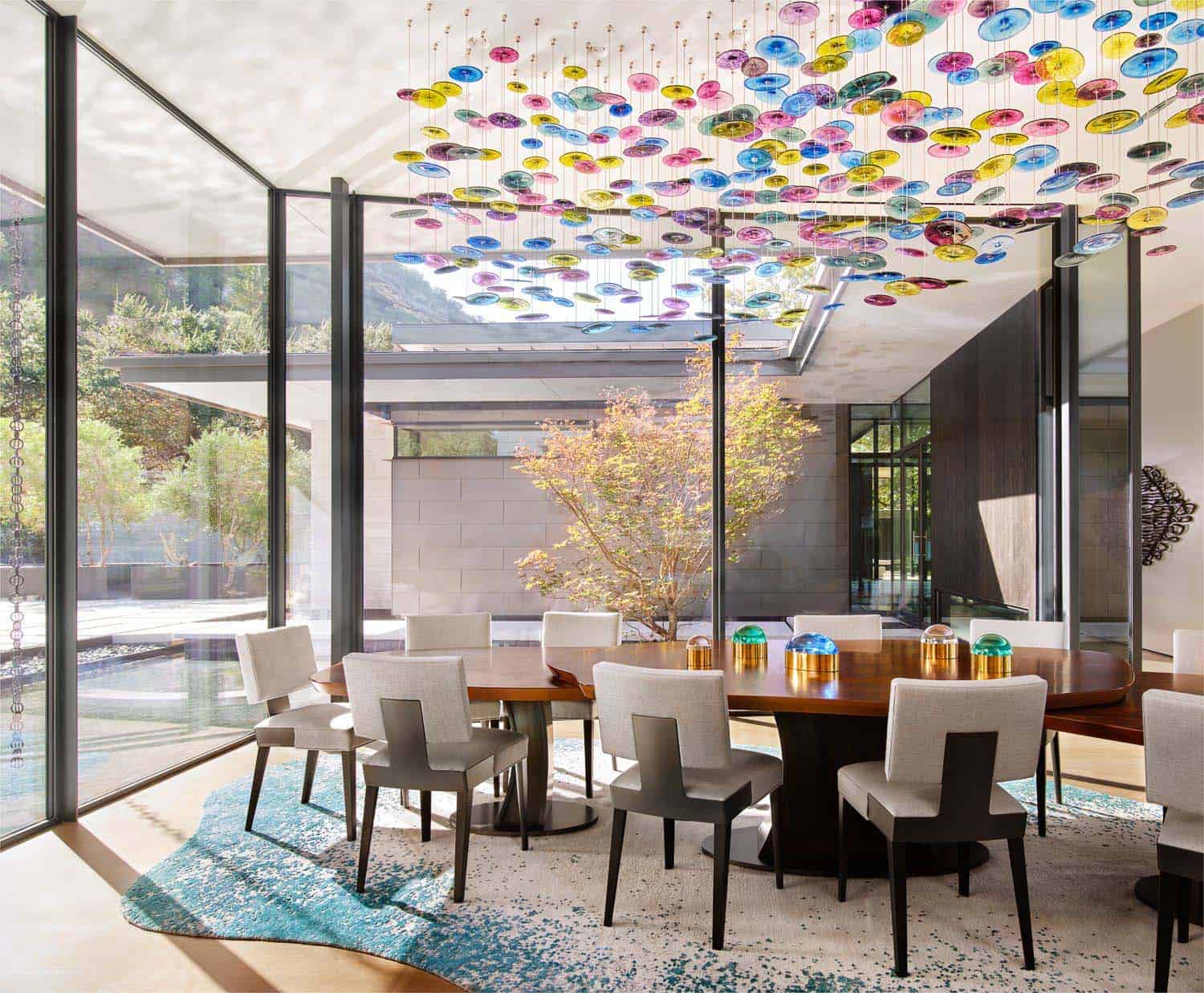 modern dining room with a colorful light fixture