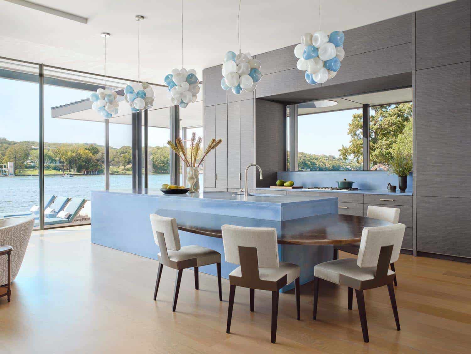 modern kitchen with pendant lights over the island