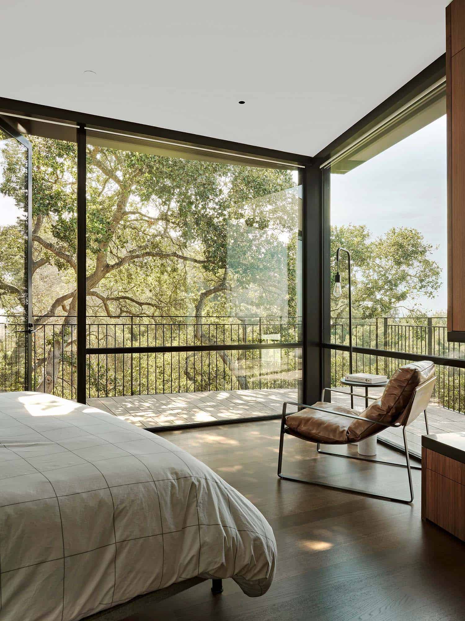 modern bedroom with floor-to-ceiling windows