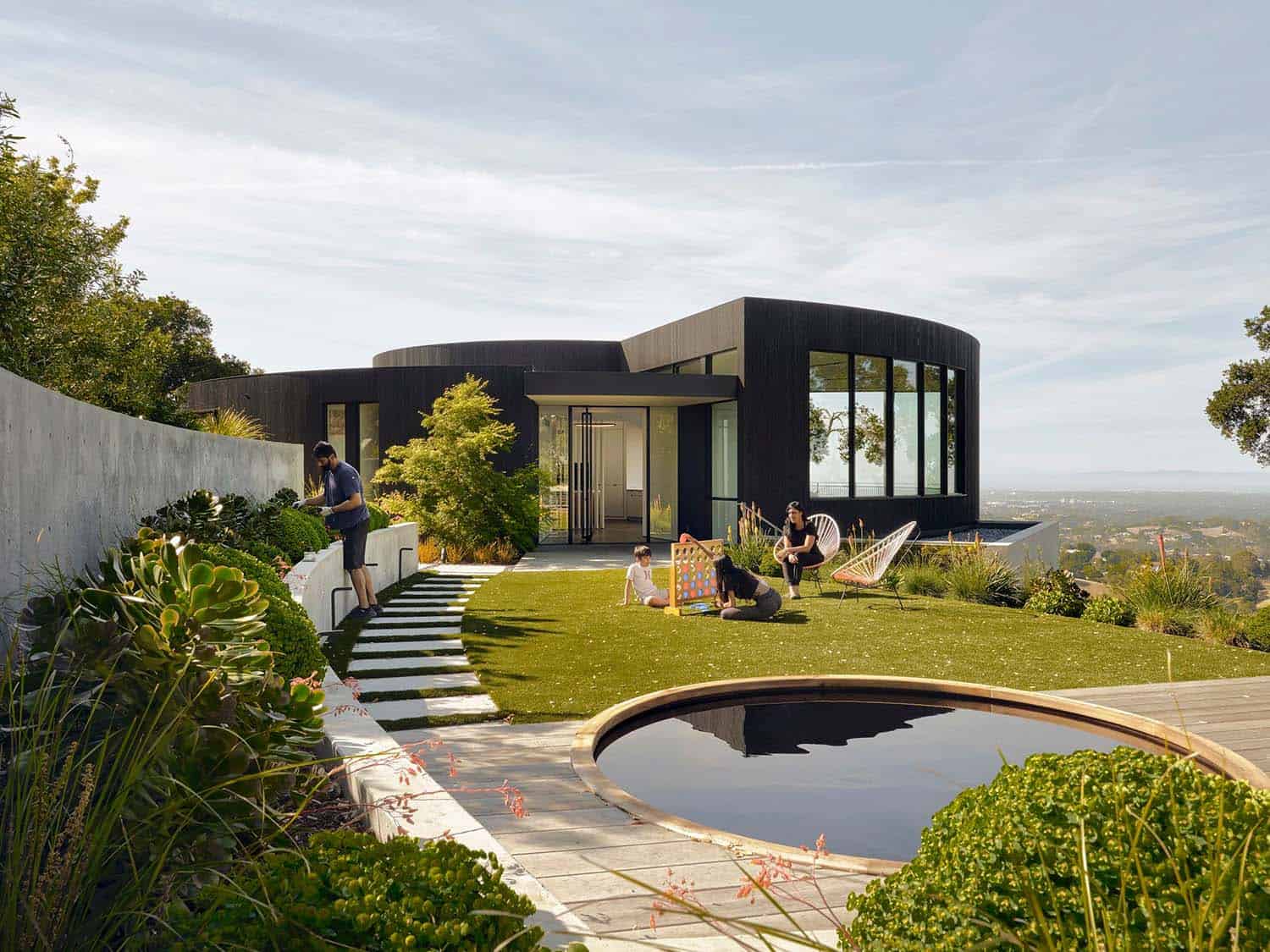 modern circular house exterior with a pool